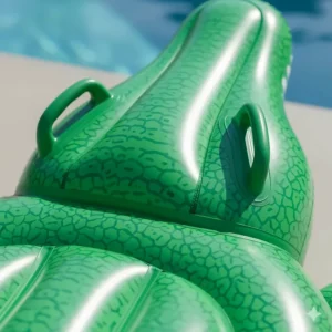 A detailed view of the durable, textured vinyl material and integrated handles on the inflatable alligator pool float.