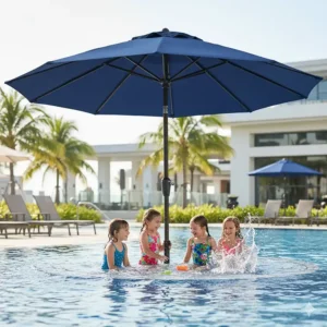Happy children playing in the pool under the cool shadow provided by a large adjustable in pool umbrella.