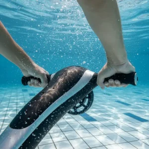 A pair of hands demonstrating the correct two-hand grip on an underwater pool scooter's control handles in clear pool water.