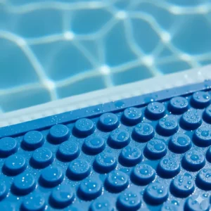 Close-up view of the non-slip texture on a pool ladder mat, showing the grip surface designed to prevent slips.