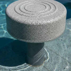 Detailed close-up of the non-slip, textured surface of a granite-gray bar stool base designed for secure placement on a vinyl liner or gunite pool floor.