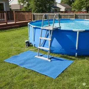 An above ground pool showing a sturdy ladder mat installed correctly under the steps.