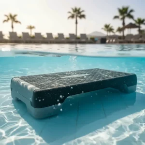 Durable plastic aqua step board submerged in a swimming pool, used to perform step aerobics and increase workout difficulty with water resistance.