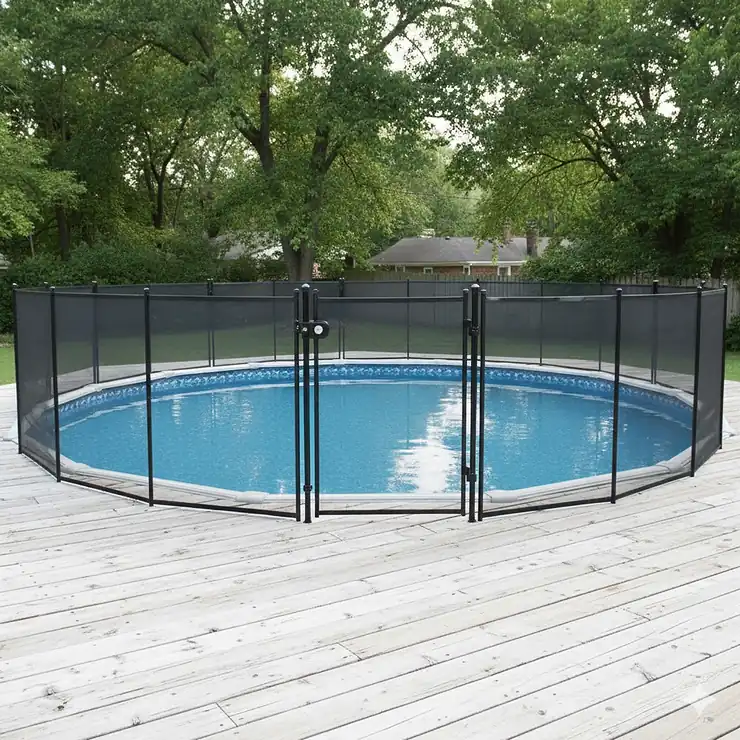 Durable mesh pool safety fence installed around a large above ground pool deck, featuring a self-latching gate for secure access.