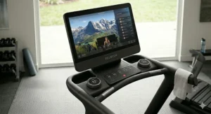 The Peloton Tread screen displaying the live leaderboard and real-time community metrics.