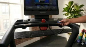 A view of the Peloton Tread safety key and the red stop button on the center console.