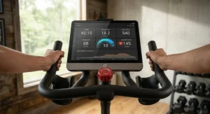 Digital monitor displaying workout metrics on a quiet belt drive indoor cycling bike