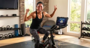 A smiling fitness enthusiast celebrating a personal milestone while finishing a ride on the best echelon bike.