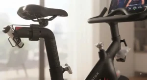 Detailed view of the adjustable seat and handlebars on the Peloton Bike for custom fitting