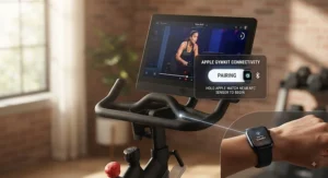 Peloton Bike Plus screen displaying seamless Apple GymKit pairing with an Apple Watch