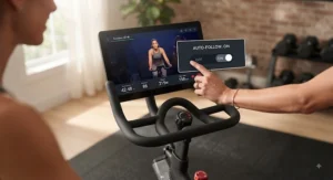 User adjusting auto-follow resistance settings on the Peloton Bike Plus display