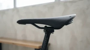 Profile angle of an ergonomic gel bike seat for exercise bike showing its contour and cushioning.