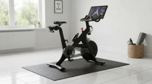 A heavy-duty exercise bike mat safeguarding ceramic tile floors from scuffs and equipment weight in a home gym.